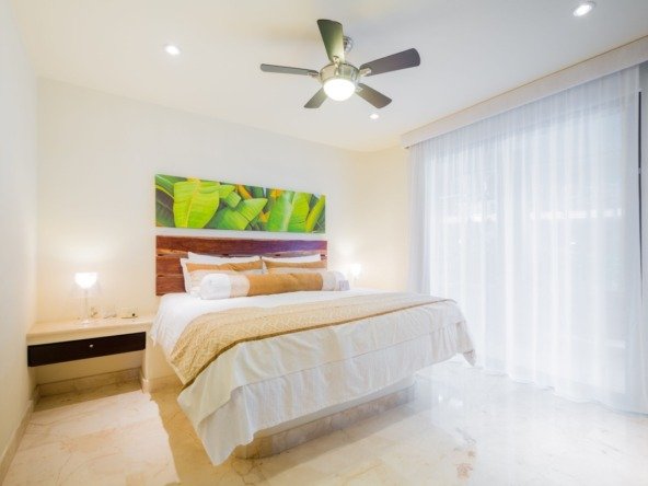 Beachfront condo for sale in Playa del Carmen – bedroom with natural and artificial lighting