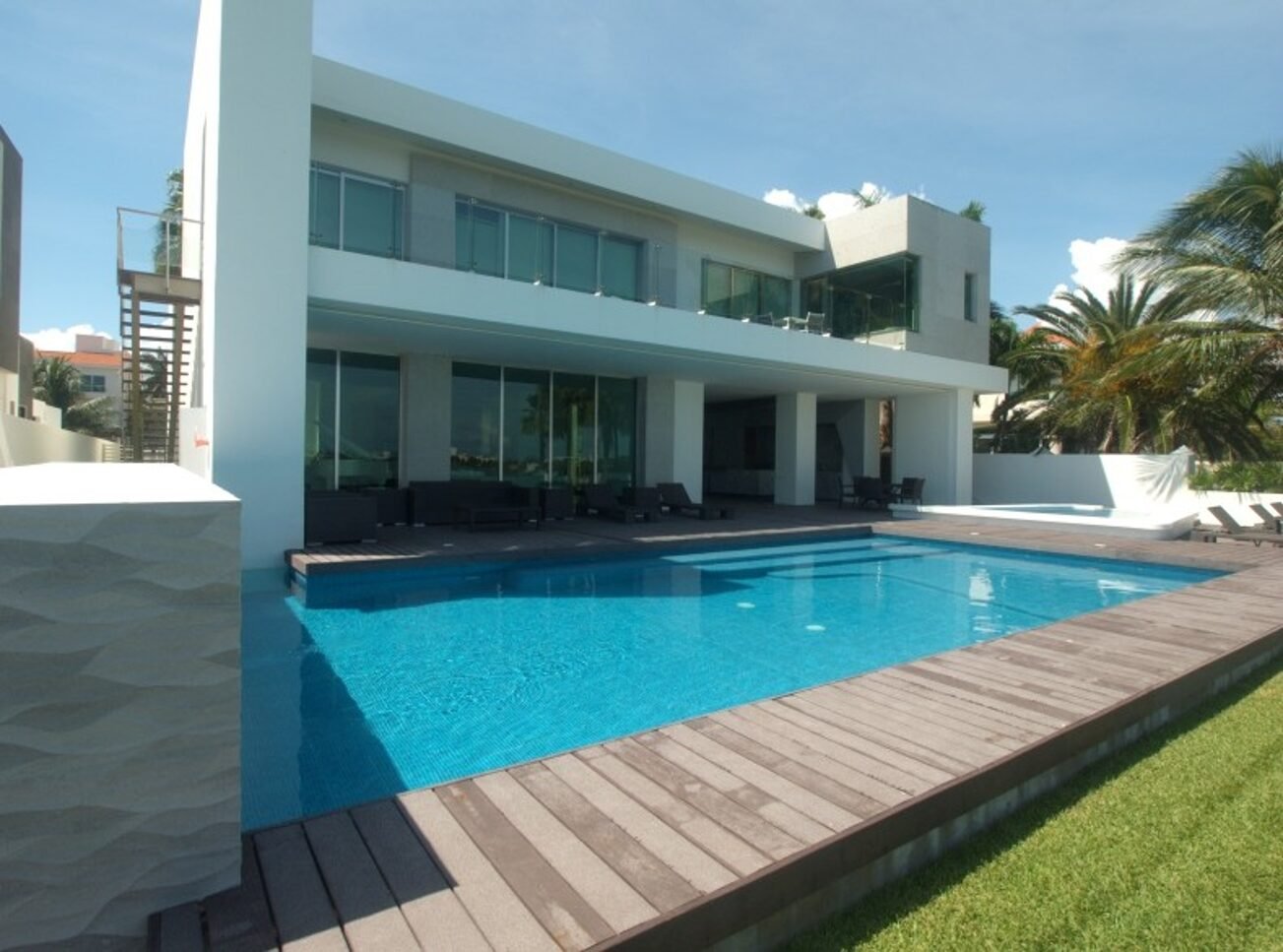 House for sale Isla Dorada Cancun - pool with view toward side corridor of the house