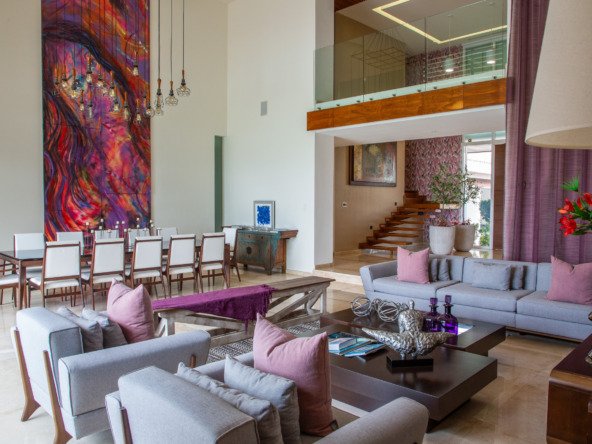 House for sale Isla Dorada, Cancun hotel zone - living room and dining room at the back, highlights the high ceiling