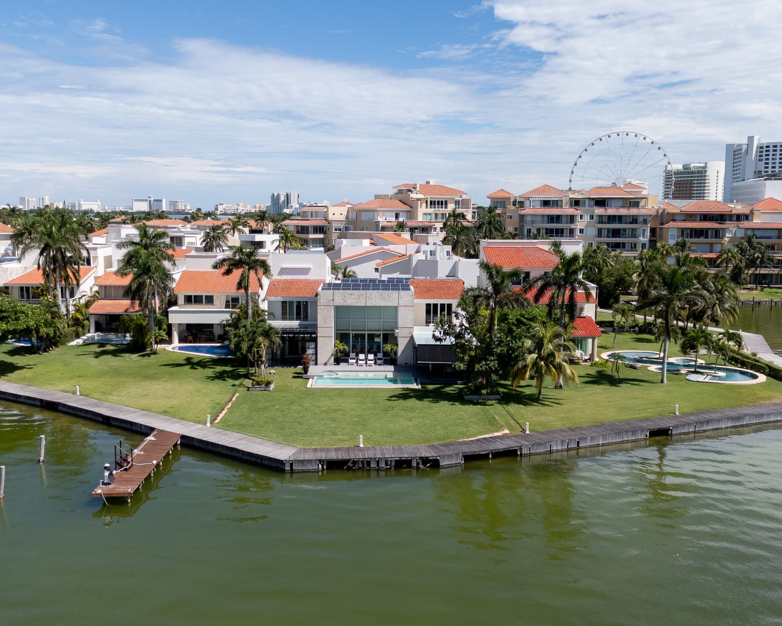 House for sale Isla Dorada hotel zone Cancun - aerial view of the house. The view toward the lagoon can be appreciated.